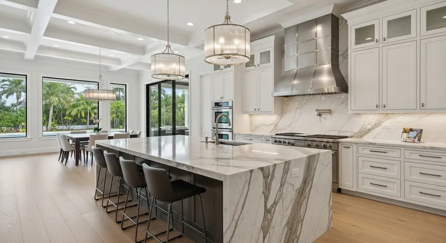 Completed high-end kitchen remodel in a Florida home with marble countertops and custom cabinetry